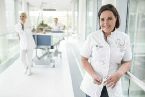 A group of nurses standing in a hallway.