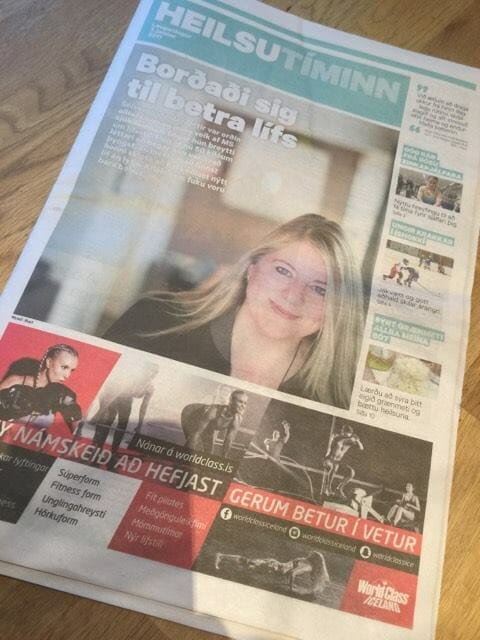 A newspaper with a picture of a woman on it.