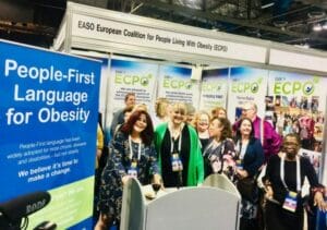 A group of people standing in front of an ECO2019 booth.