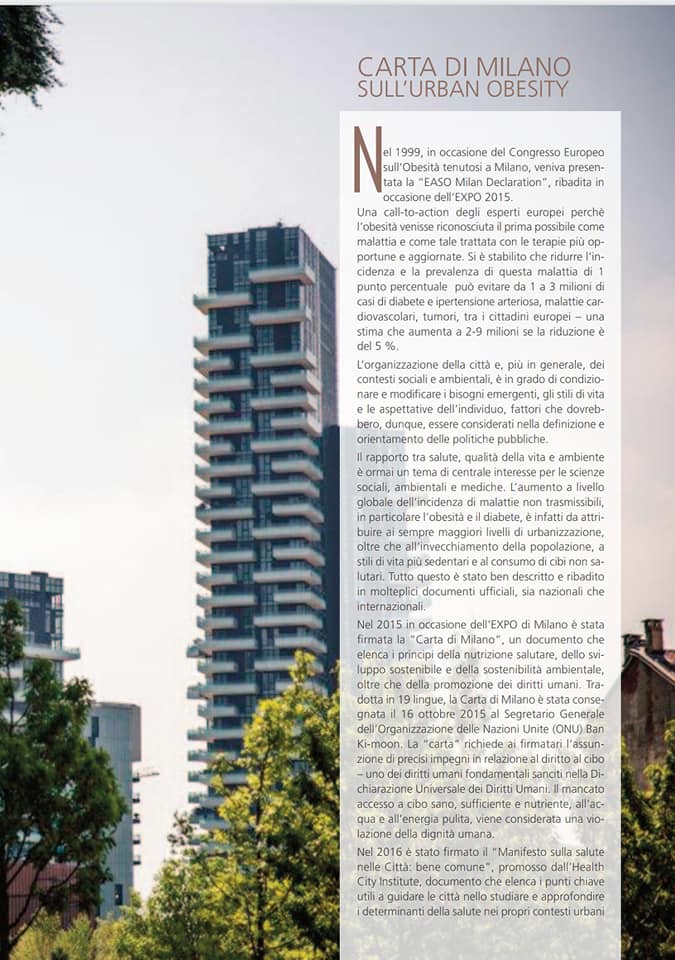 A magazine with a picture of a tall building and trees.