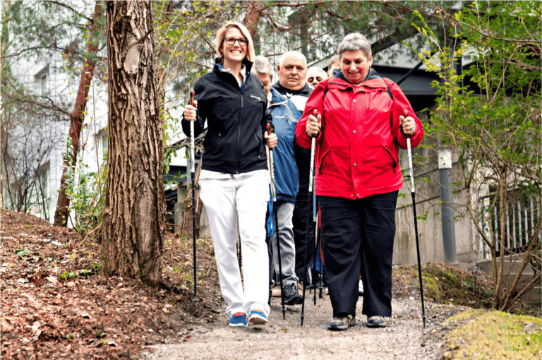 A group of people walking down a path.