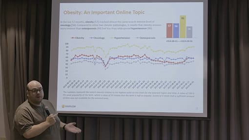 A man giving a presentation on a screen.