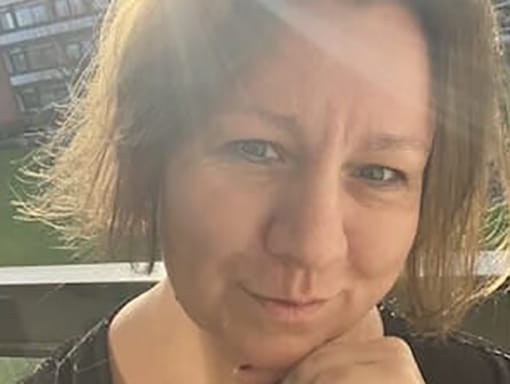 A woman taking a selfie.