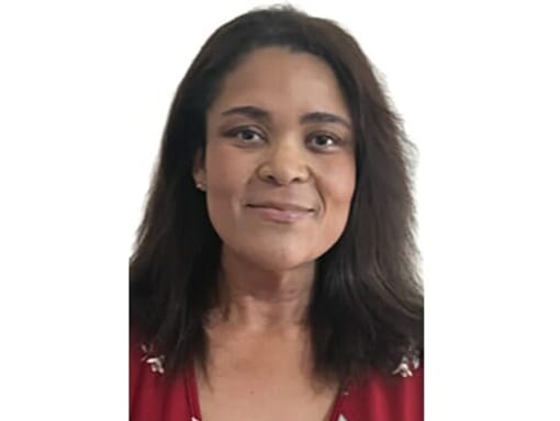 A woman smiling at the camera.