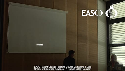 A man standing in front of a white board.