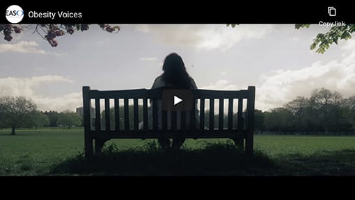 A person sitting on a bench.