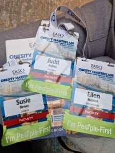 Three conference badges on a lanyard for the EASO Obesity Masterclass. The badges belong to Judit from Hungary, Susie from Ireland, and Ellen from the Netherlands, all labeled as faculty.
