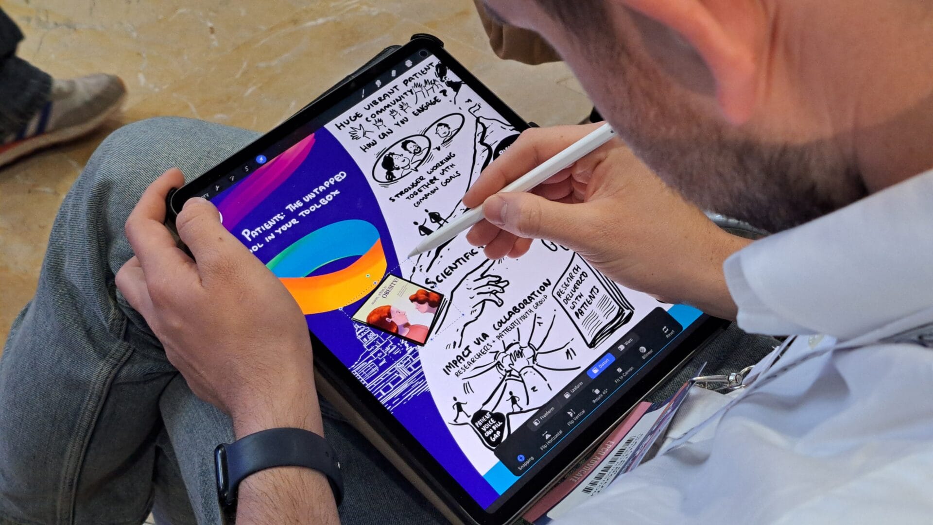 Person using a stylus to draw sketches and take handwritten notes on a tablet screen displaying colorful and black-and-white illustrations.